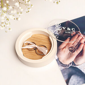 White gypsum ring bearer box with natural oak insert, magnetic glass lid, and ribbon for securing rings