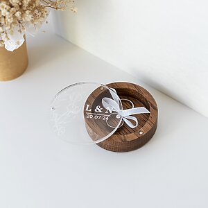 Dark wooden wedding ring box with elegant design for engagement rings and wedding bands.