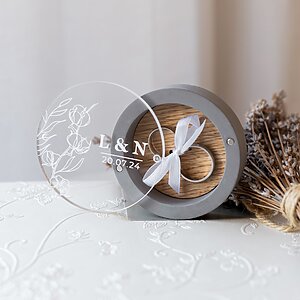 Charming gray gypsum ring box with oak insert, magnetic glass panel, and ribbon to hold rings. Customizable engagement ring holder for weddings.