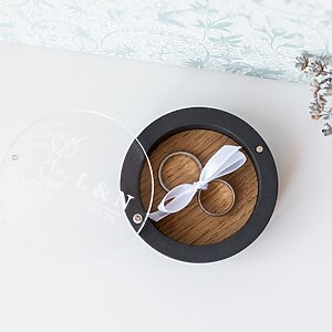 Handcrafted black gypsum engagement ring box with oak insert, magnetic glass cover, and ribbon holder for securing rings