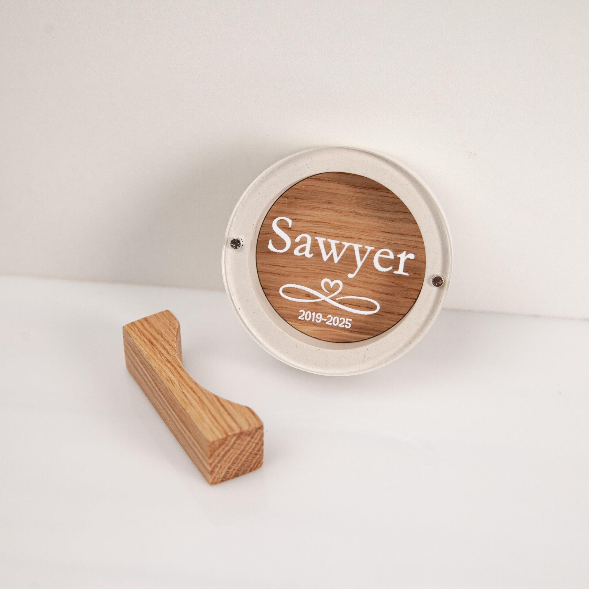 Round white gypsum and oak dog hair keepsake box with custom pet name and dates