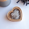 Heart shaped oak dog hair keepsake box containing pet fur with custom UV-printed name Ella on the clear acrylic lid