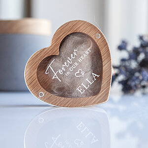 Heart shaped oak dog hair keepsake box standing upright with a custom name on the clear lid